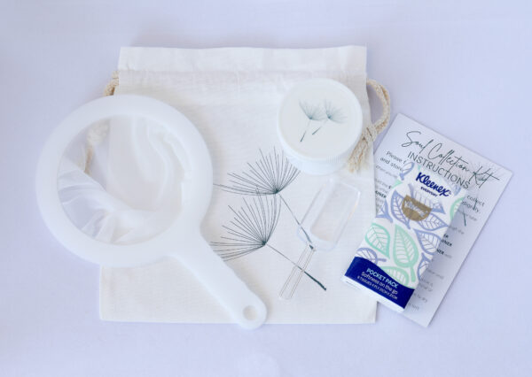 White strainer, opaque jar, scoop, carry bag, instruction card and packet of facial tissues.